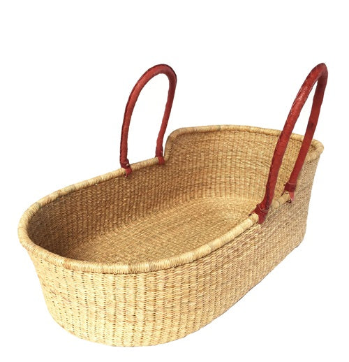 Moses basket hand woven in Ghana Africa from straw with leather handles