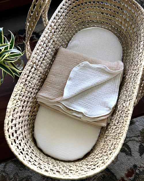 palm leaf Moses basket with linens by Wendy Anne