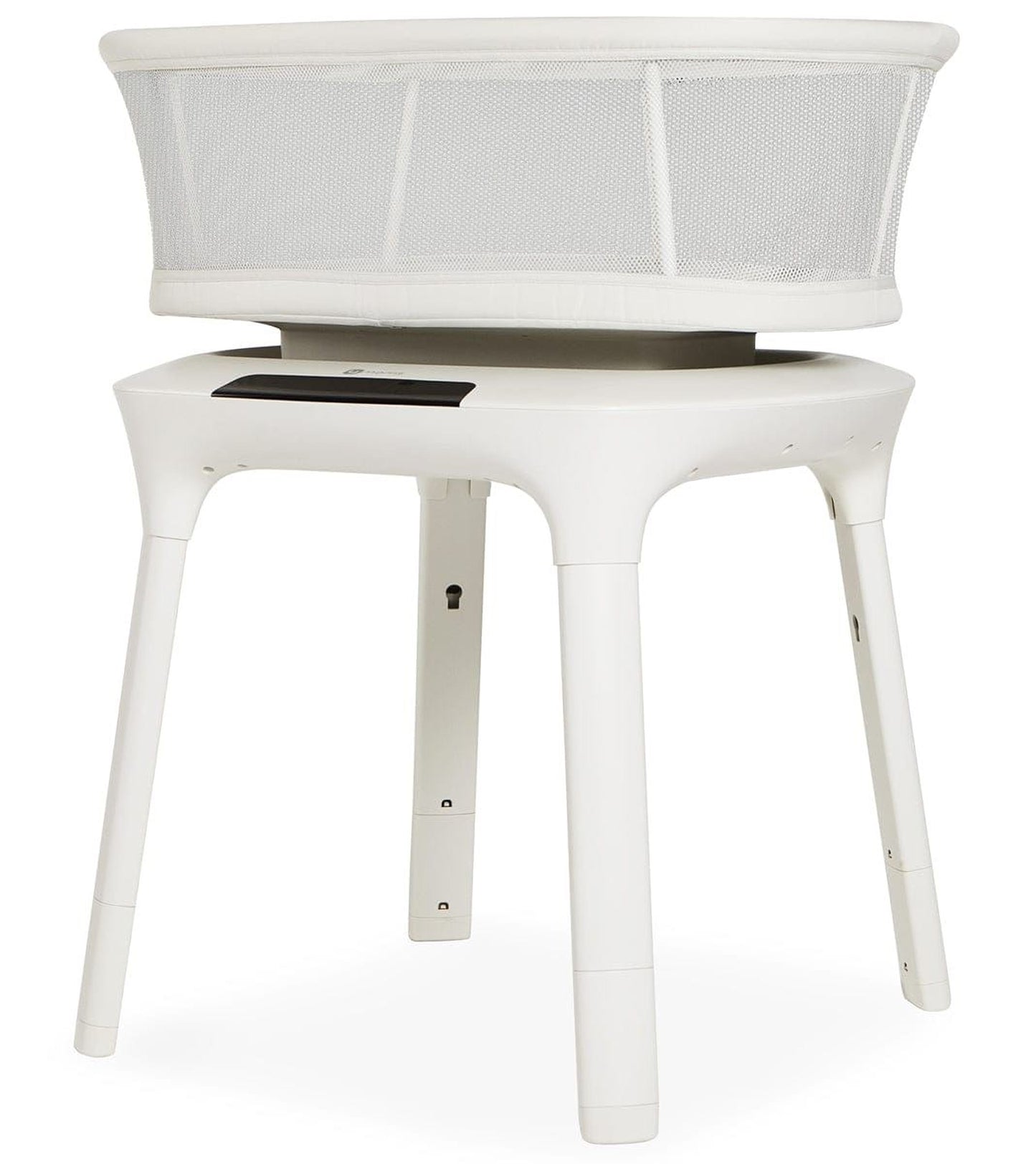 A white, modern-looking crib or bassinet with a mesh cover, designed for newborns or young children.
