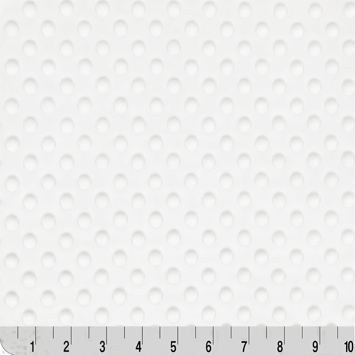 The image is a close-up of a white fabric with a repeating pattern of small circles or dots.