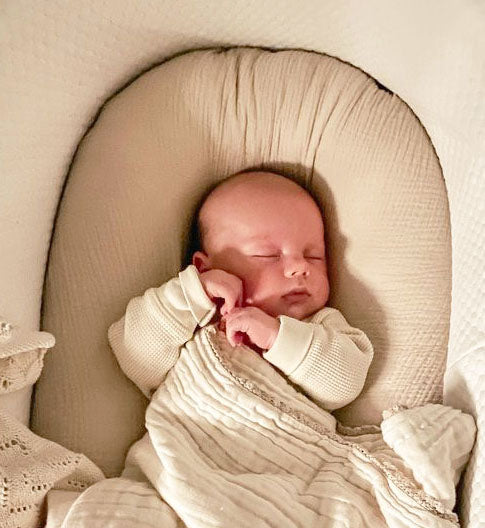 baby laying in lounger with slip cover in organic cotton double gauze
