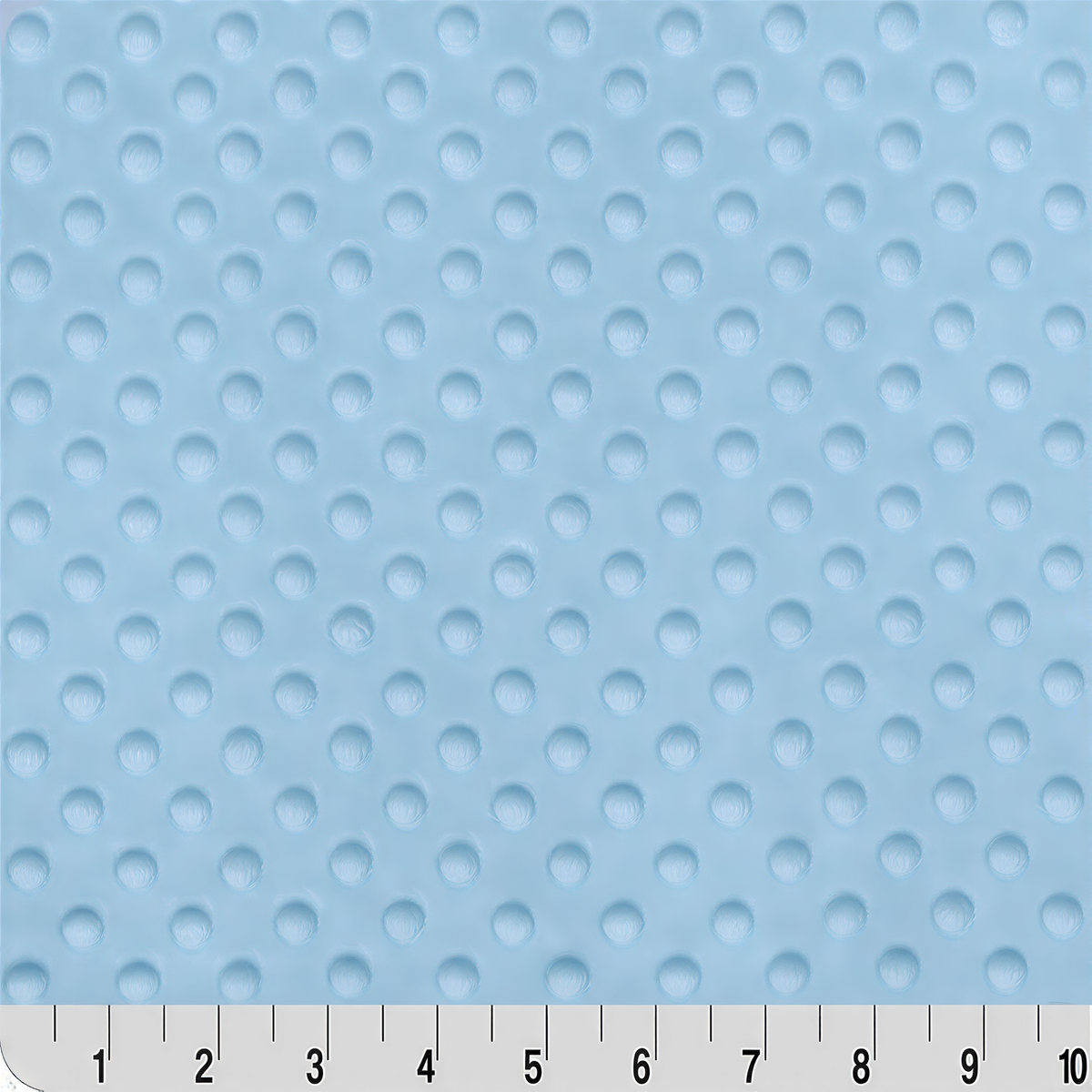 a close-up view of a light blue fabric with a dotted pattern. The fabric appears to be soft and textured, suitable for use in clothing or bedding.