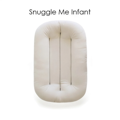 A white, rectangular object with three vertical lines running through it, labeled as a "Snuggle Me Infant" product.
