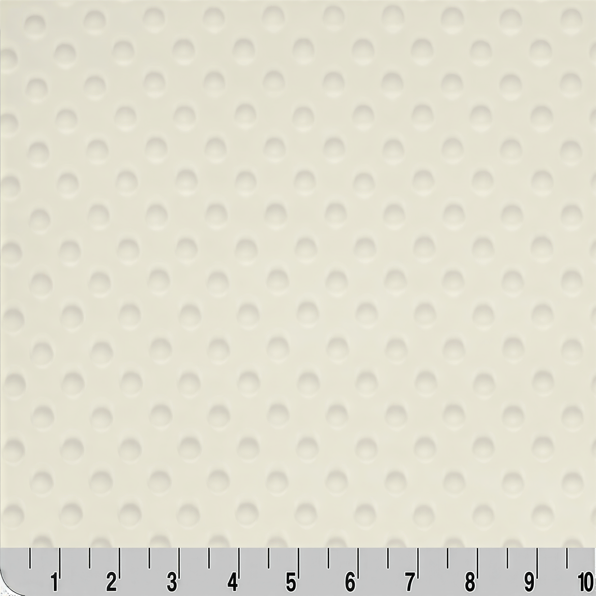 a close-up view of a fabric with a repeating pattern of small white circles or dots, creating a textured appearance.