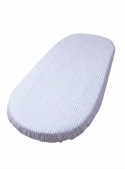 A white oval-shaped object with blue stripes on it.