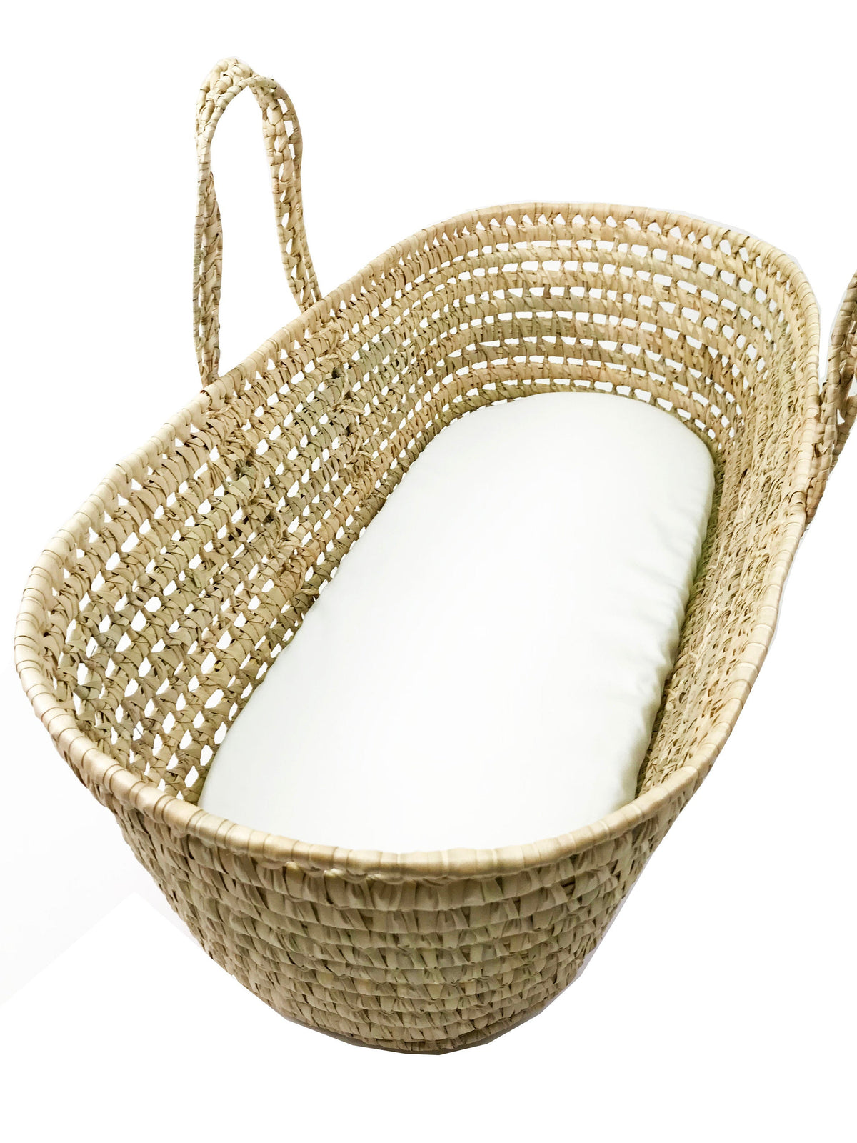 A woven basket with a white mattress inside.